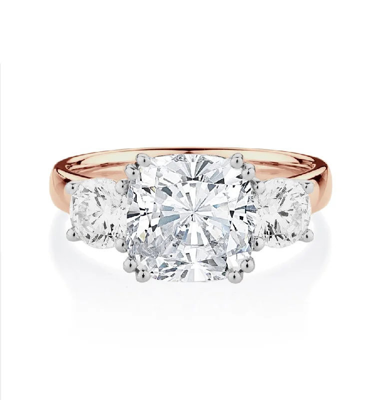 Exclusive Jewelry Sale – Grab Timeless Pieces Now Three stone ring with 3.75 carats* of diamond simulants in 10 carat rose and white gold